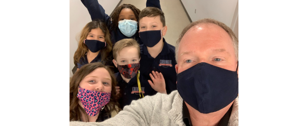 Selfie image of Dr. Gott and 5 elementary students while wearing masks.
