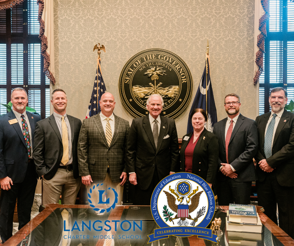 a group of people standing in front of a seal that says seal of the governor